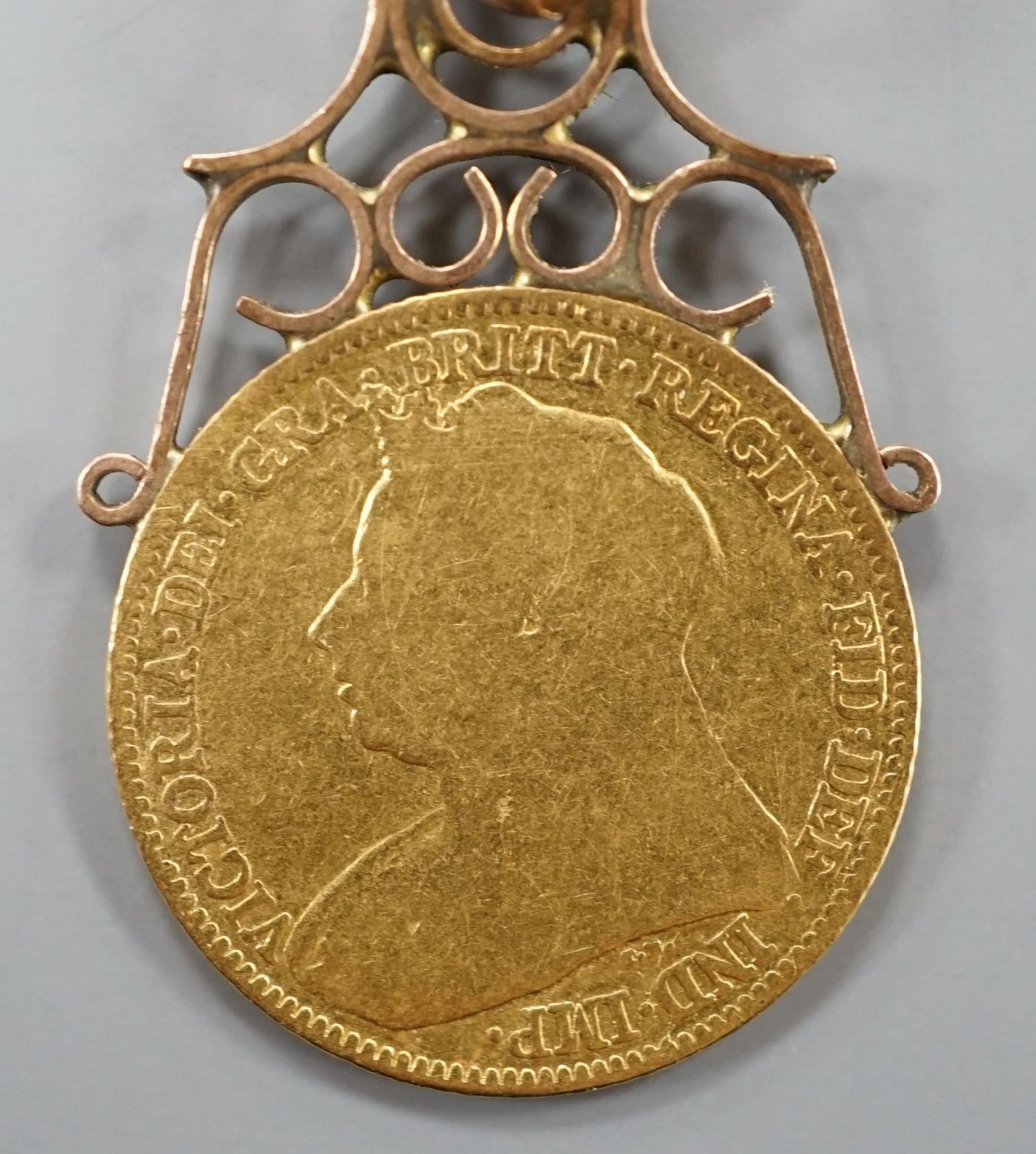 A Victorian gold 1896 half sovereign, now with yellow metal pendant mount